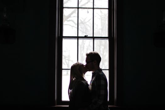 kissing at window